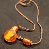 Vintage pressed amber pendant with leather lace